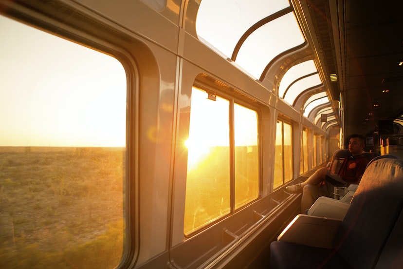 A young man watches the sun rise over Texas on the Amtrack train travelling from San Antonio to Alpine.