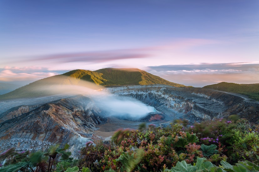 High angle view of crater emitting smoke at sunset, Poas volcano, Costa Rica